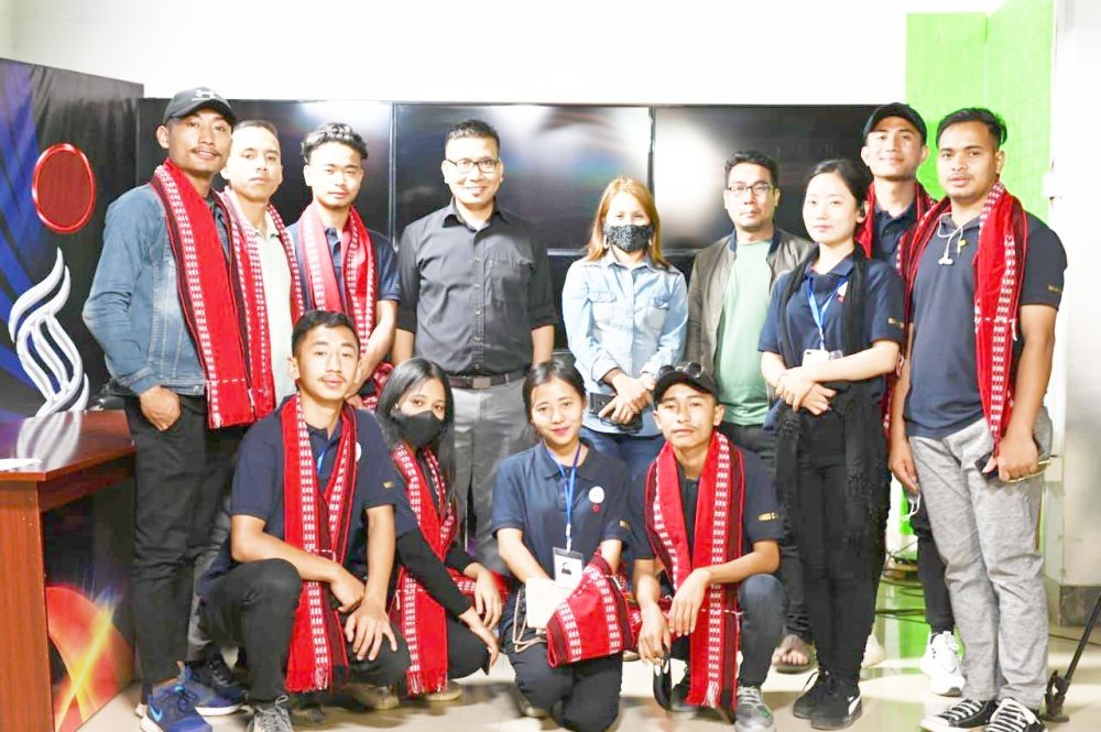 Students with Bureau in Chief Prem Aribam and Associate Editor Joyshree Usham of Impact TV.